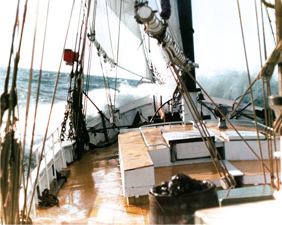 deck of ship Pioneer with waves breaking over bow